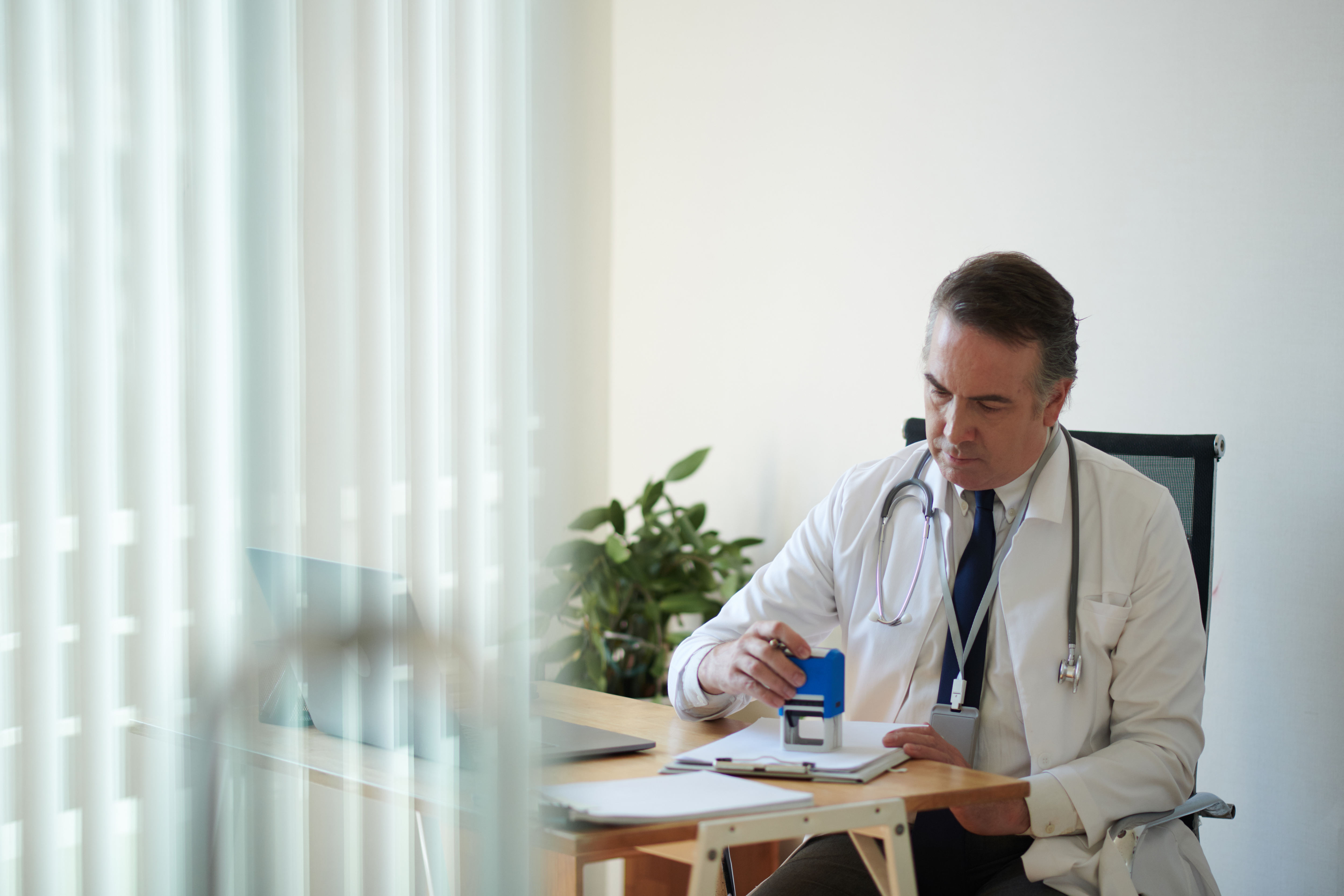 Hospital staff reviewing contracts