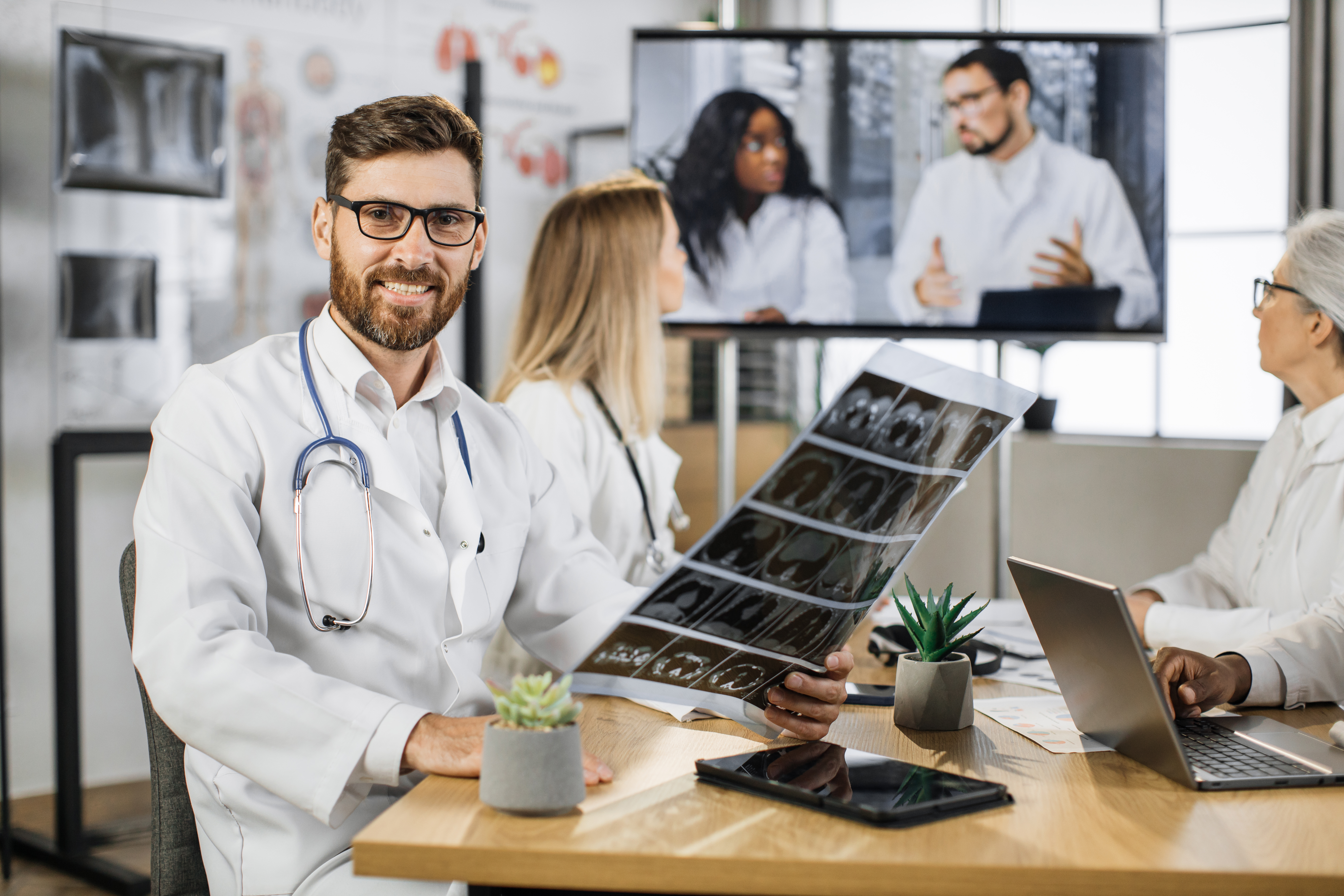 Doctor reviewing X-ray at online seminar