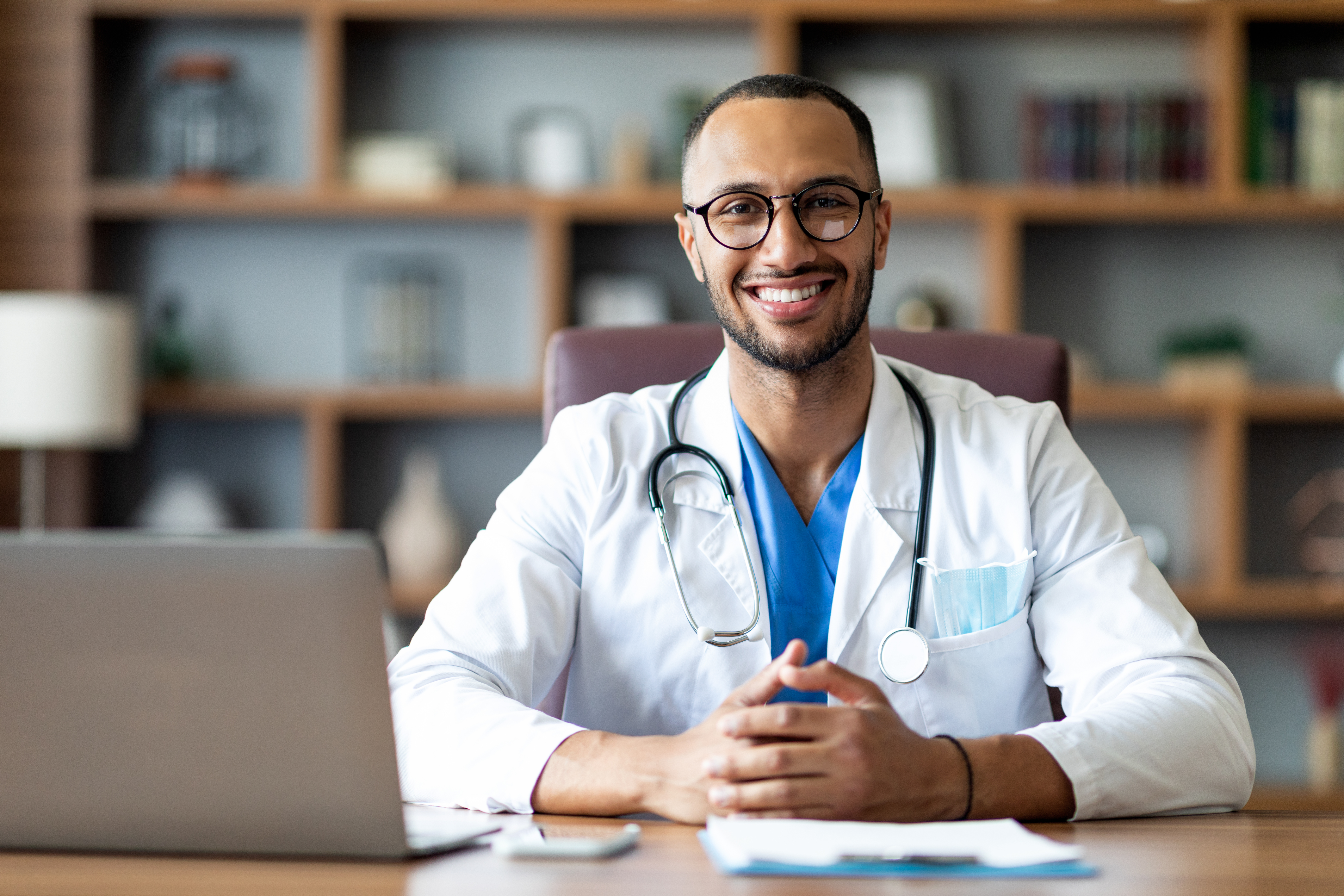 Happy doctor posing at clinic